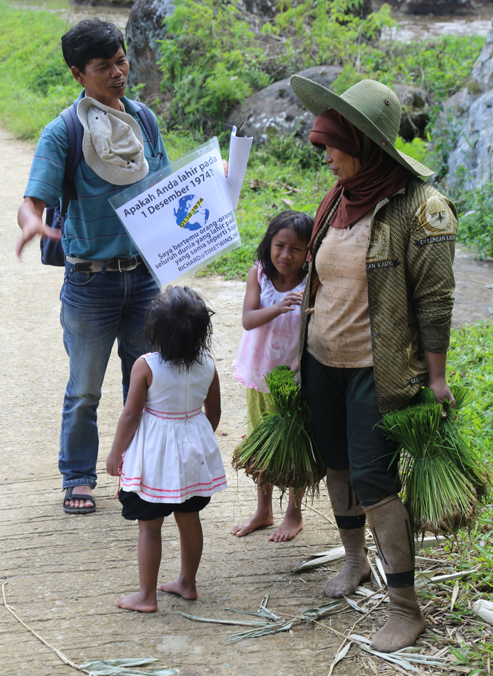 Yohanis Utta engaging Torajan locals in the search for Time Twins